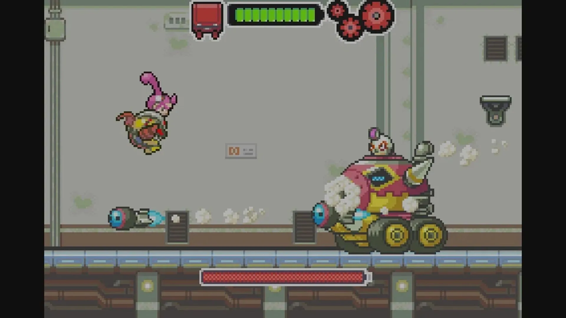 Ảnh chụp màn hình game Drill Dozer trên GBA, nhân vật Jill điều khiển cỗ máy khoan đang đối đầu với kẻ thù.