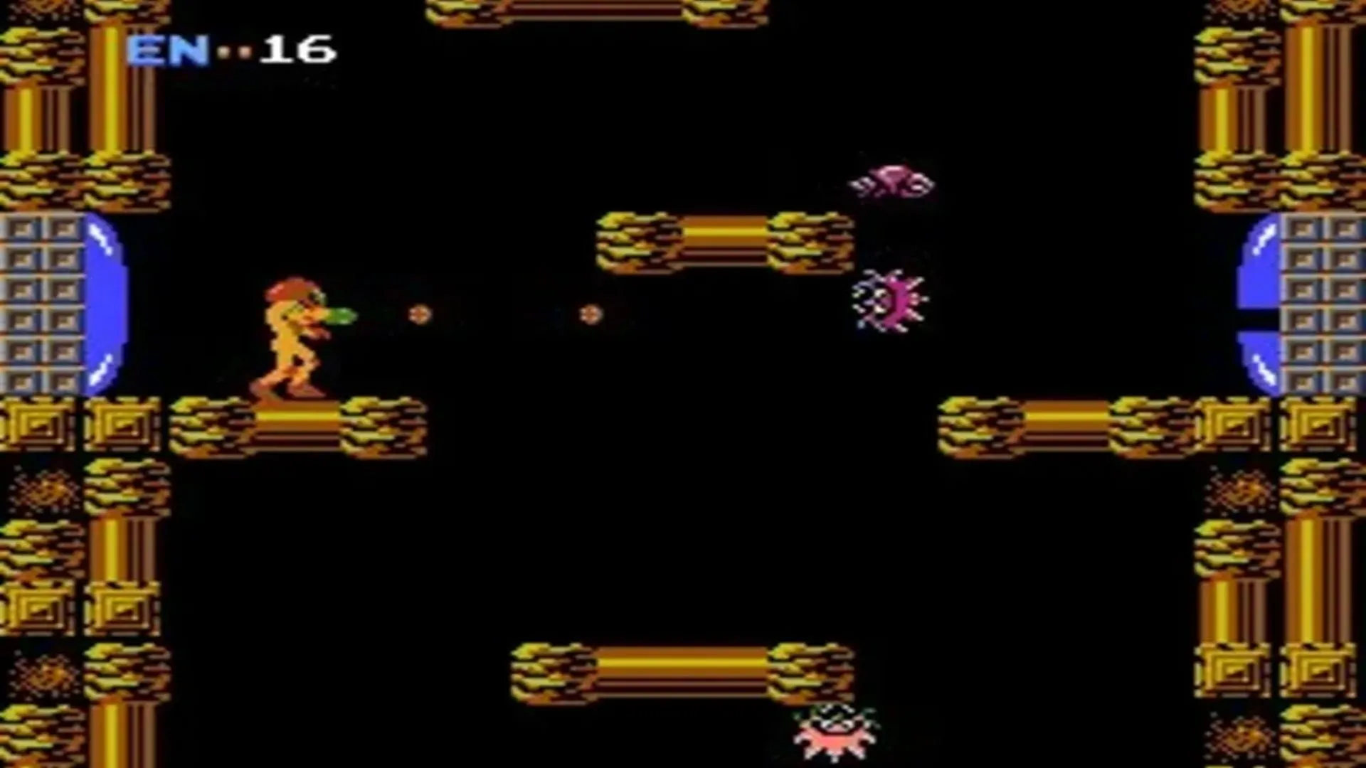 Ảnh chụp màn hình gameplay của Metroid, phiên bản gốc trên NES, hiển thị Samus Aran đang di chuyển trong môi trường hang động