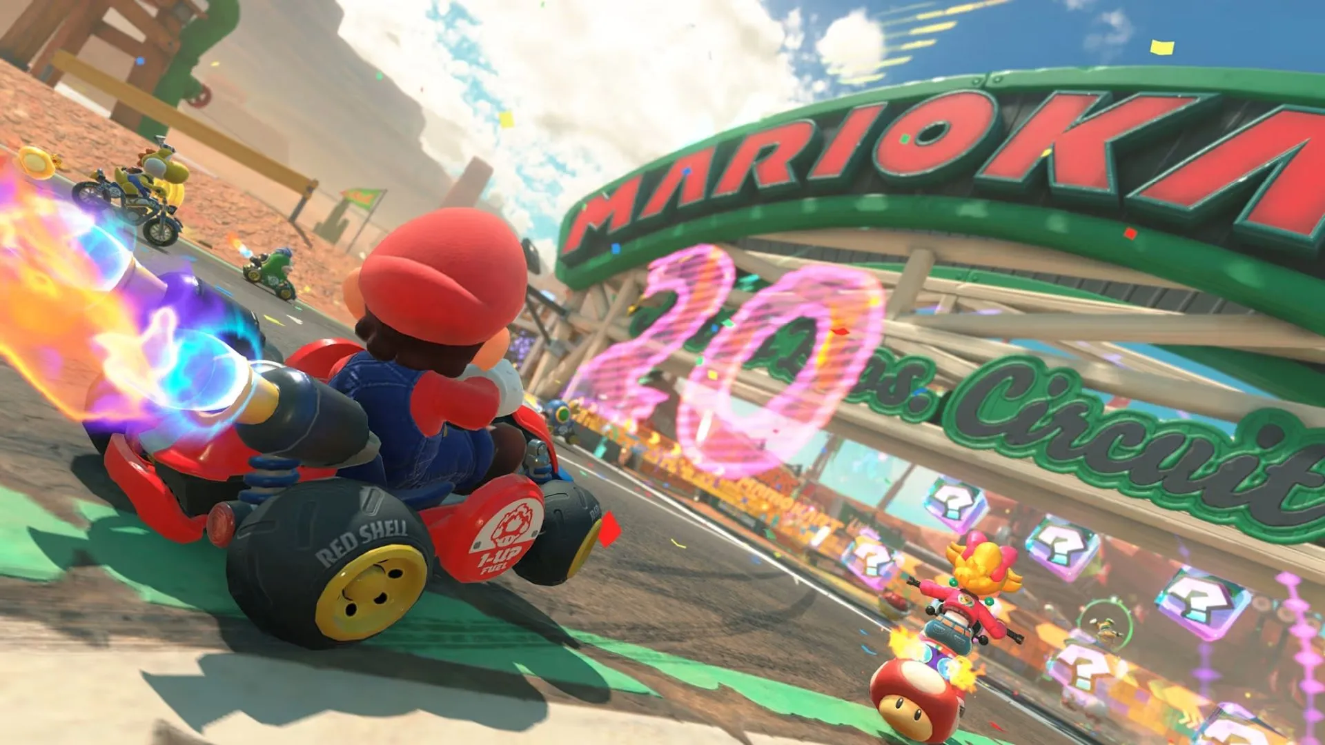 Dàn nhân vật đa dạng chuẩn bị xuất phát trong một cuộc đua của Mario Kart World