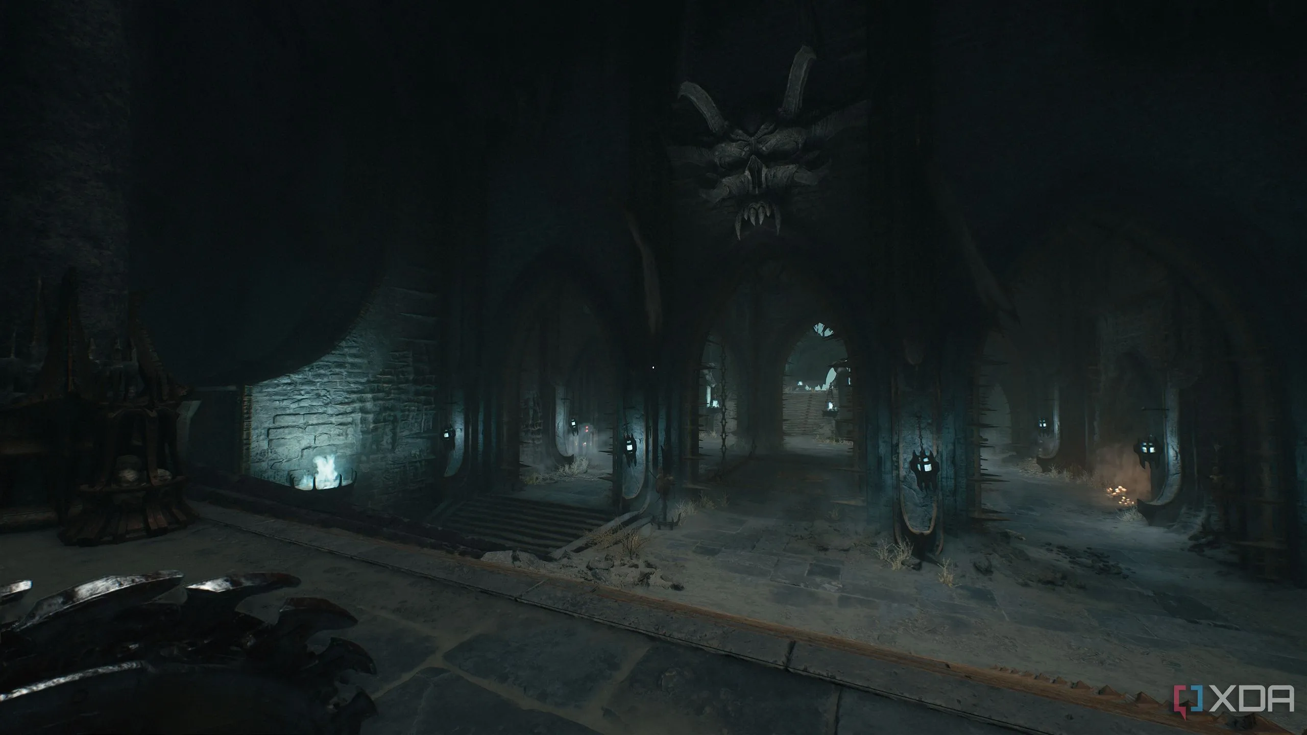 Đấu trường lớn với một đầu lâu khổng lồ trên tường trong Chapter 19 Doom: The Dark Ages