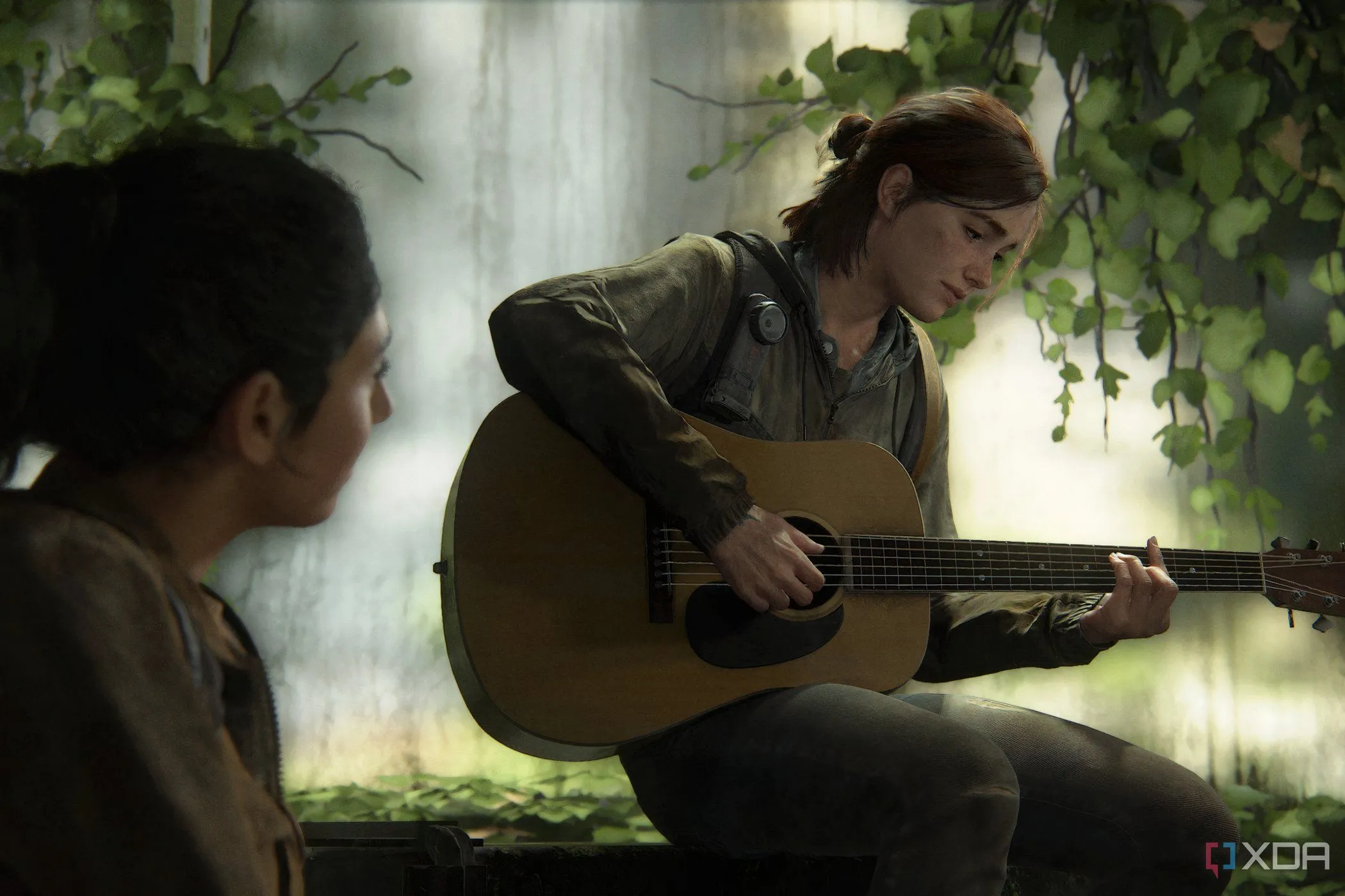 Ellie đang chơi đàn guitar trong The Last of Us Part II, thể hiện khoảnh khắc yên bình hiếm hoi giữa thế giới hậu tận thế đầy khắc nghiệt