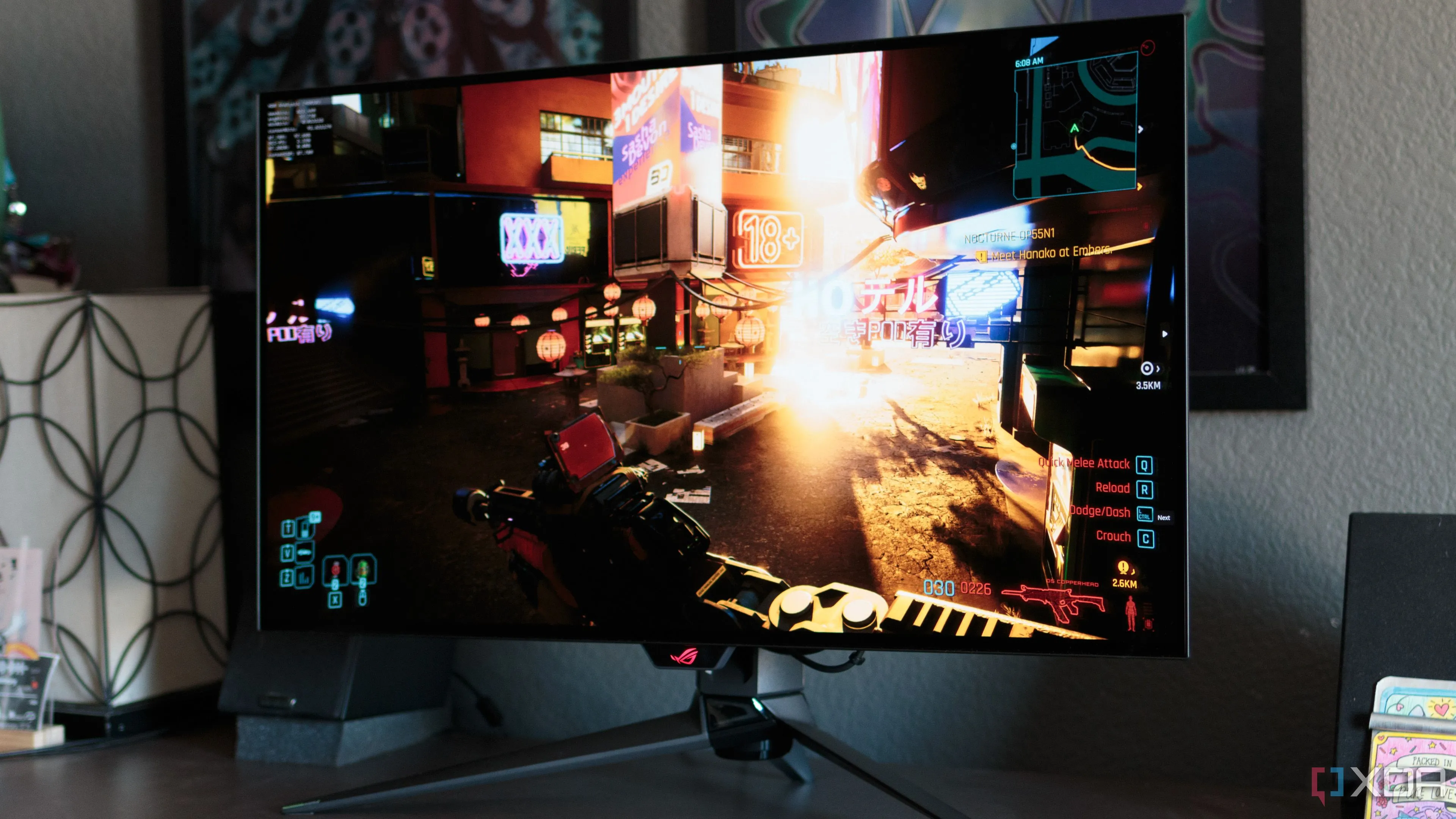 Game Cyberpunk 2077 hiển thị trên màn hình chơi game ASUS ROG PG32UCDP, tượng trưng cho công nghệ và đồ họa game hiện đại.