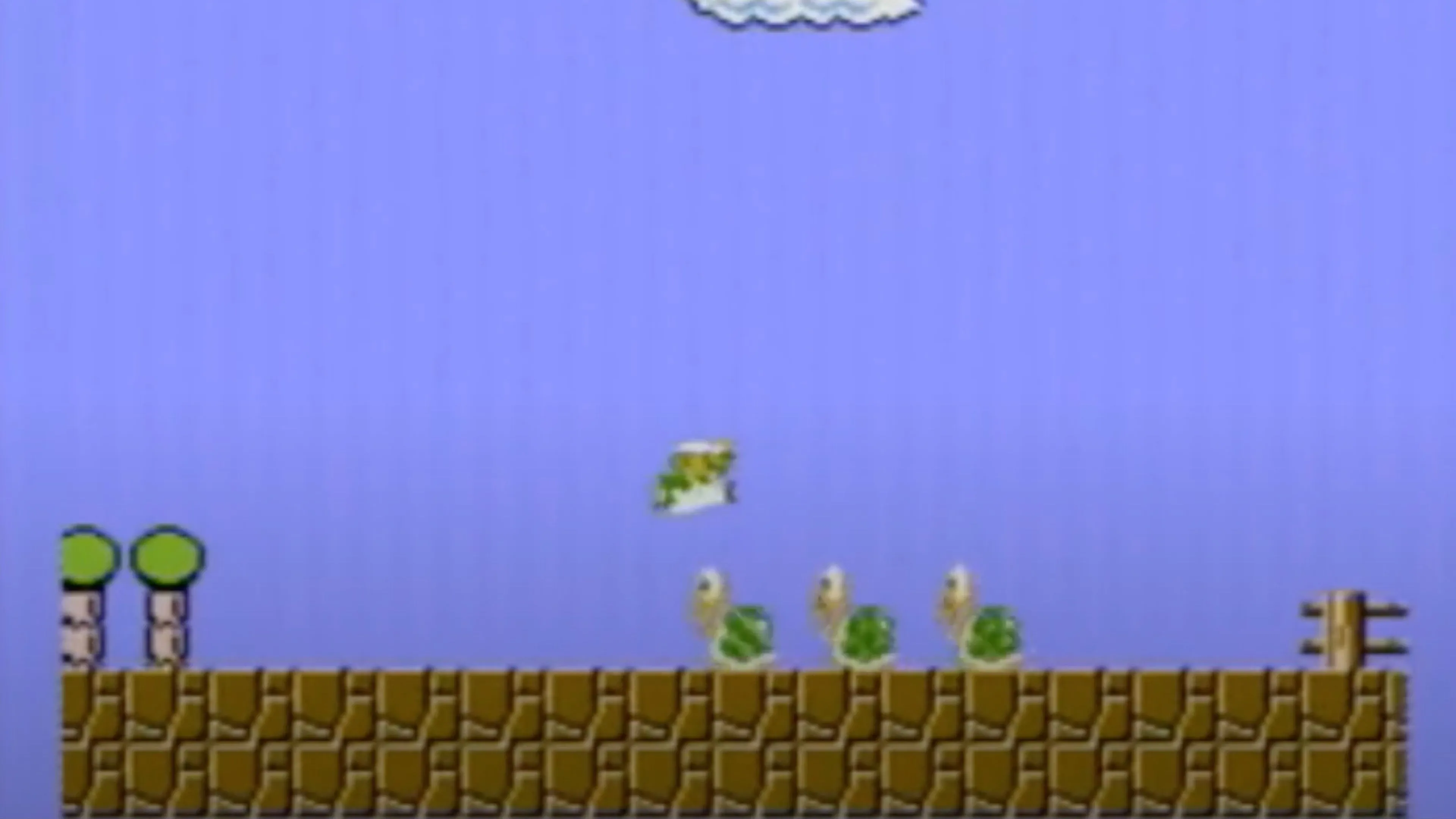 Gameplay của Super Mario Bros. với Mario trên nền xanh