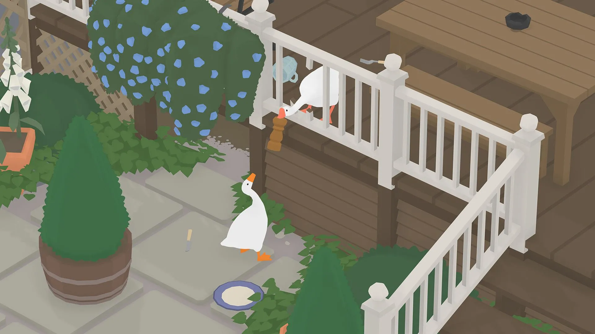 Hai người chơi cùng nhau trong game Untitled Goose Game trên một màn hình, tạo nên không khí vui vẻ