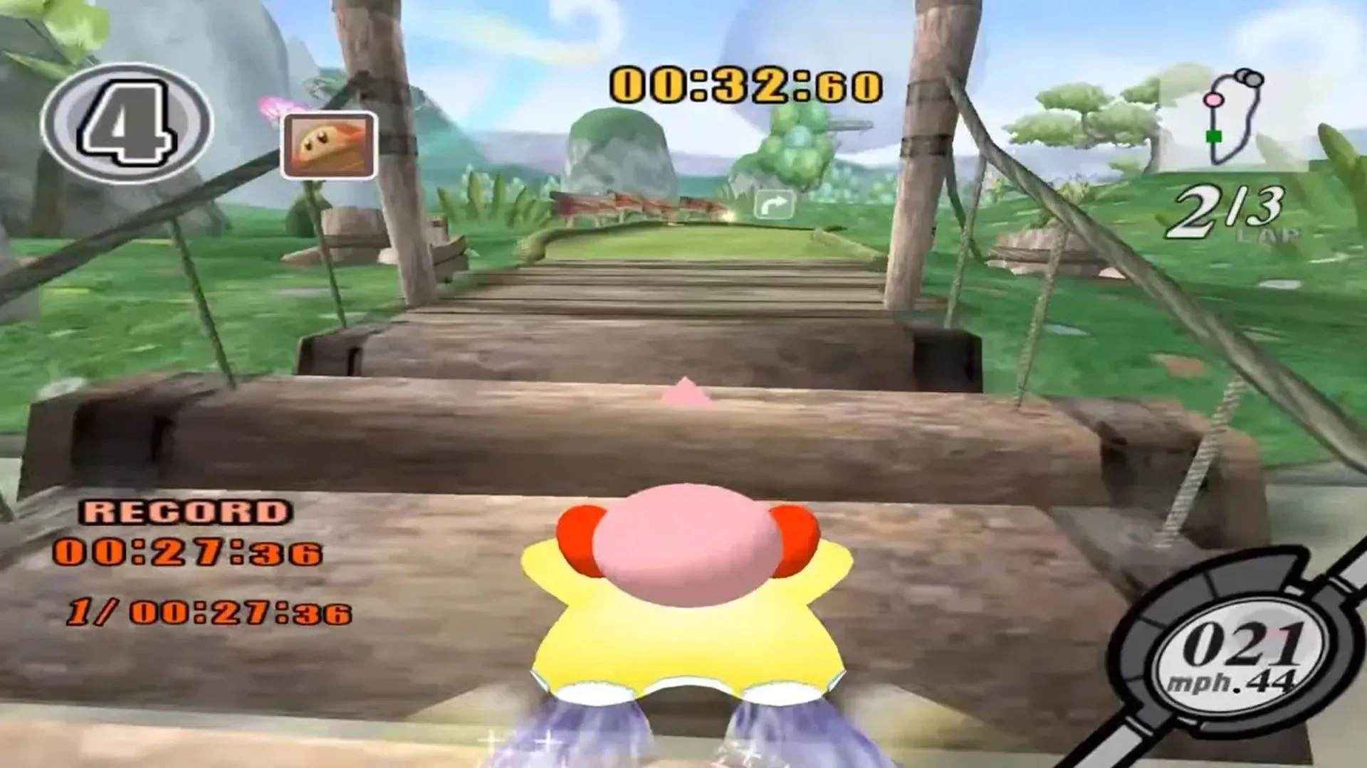 Hình ảnh gameplay của Kirby Air Ride, cho thấy nhân vật Kirby đang đua trên một chiếc xe Air Ride trong môi trường đầy màu sắc, minh họa lối chơi đặc trưng của tựa game GameCube này.