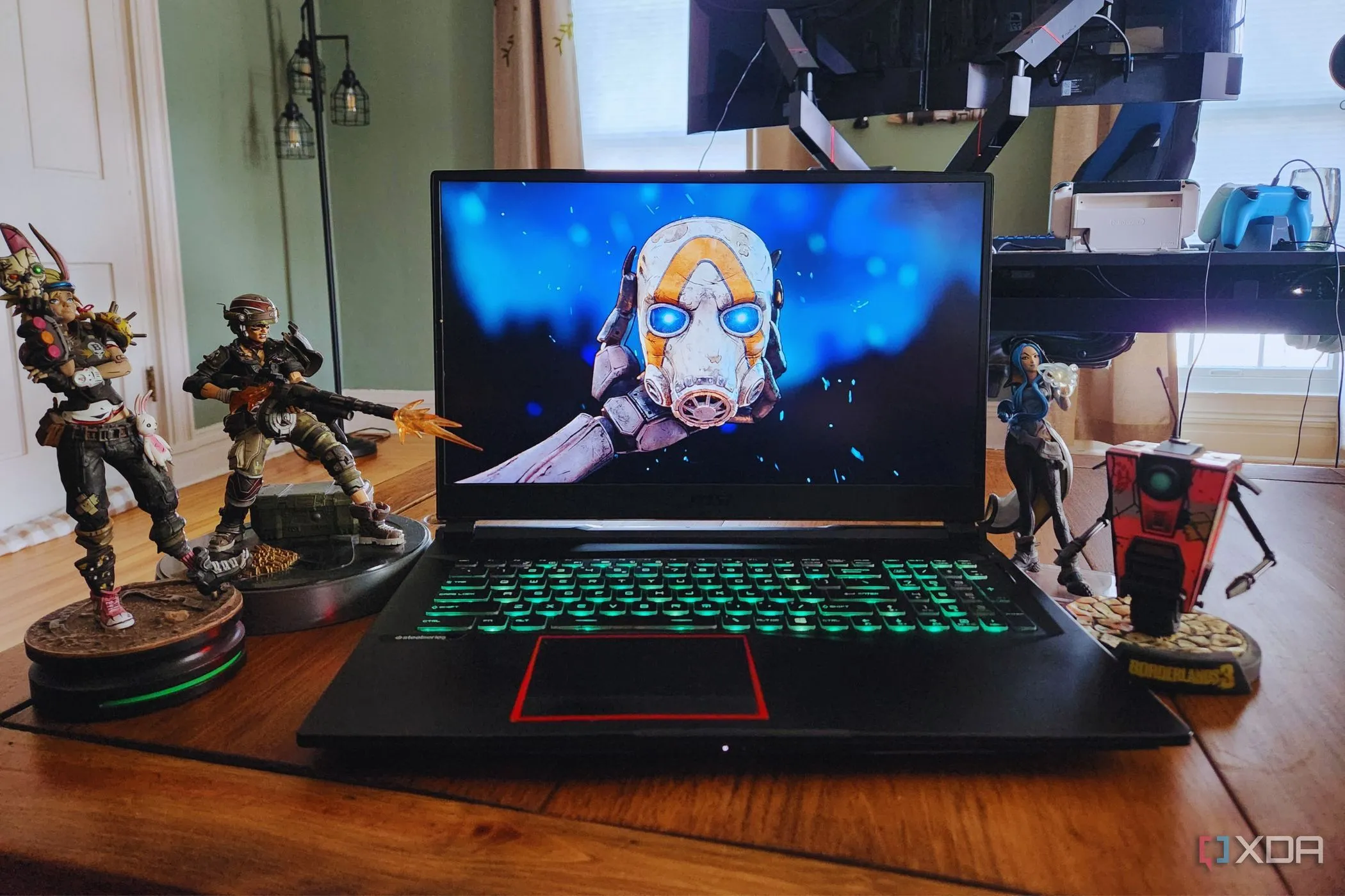 Hình ảnh quảng bá game Borderlands 4 trên laptop với các mô hình nhân vật hành động