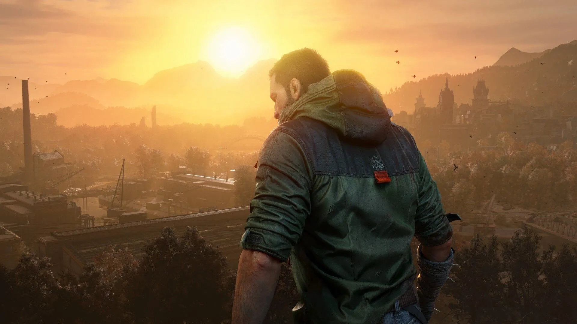 Kyle Crane đứng trên tòa nhà cao tầng, nhìn xa xăm trong bối cảnh hậu tận thế của Dying Light: The Beast