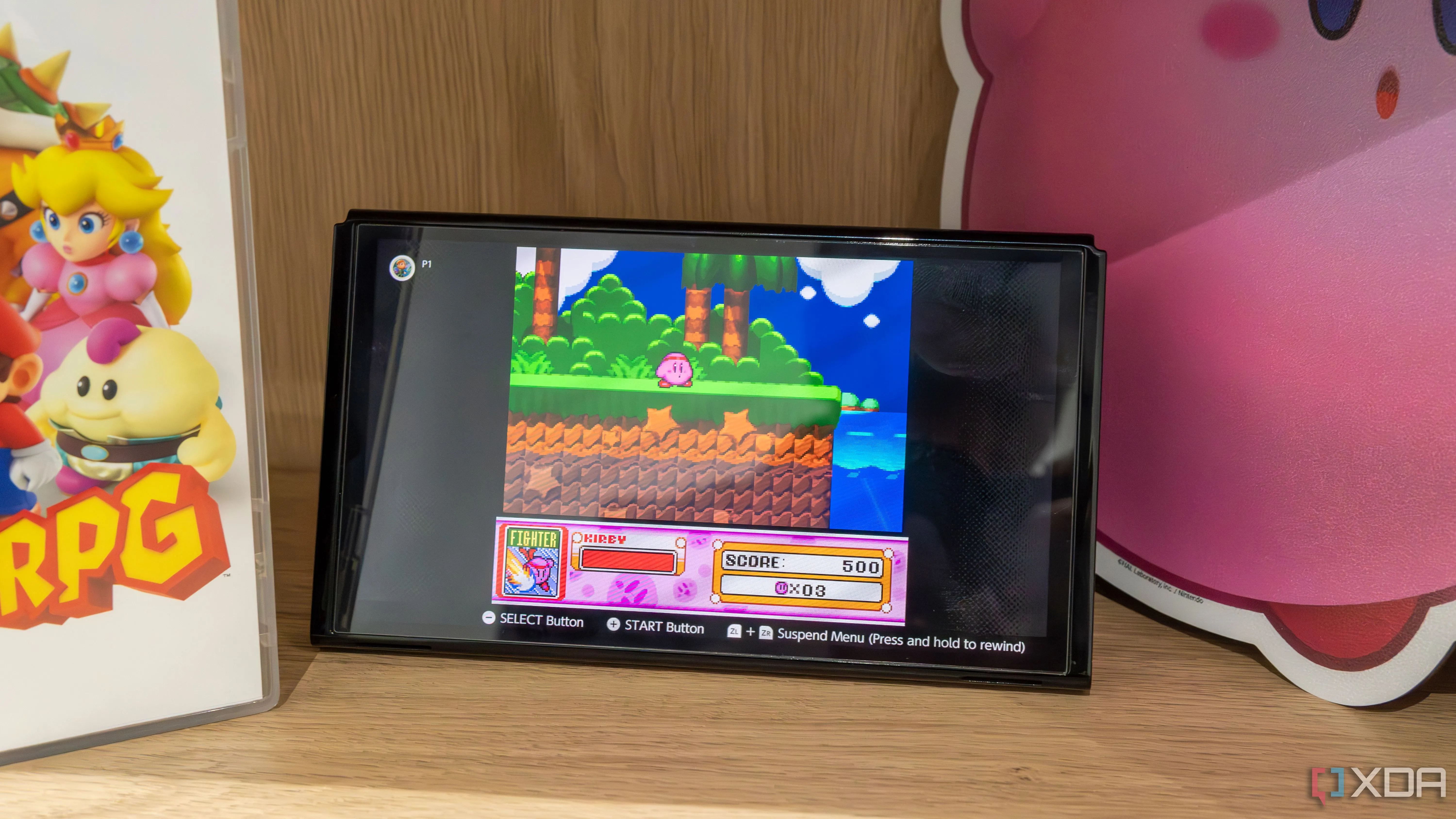 Máy Nintendo Switch OLED hiển thị game Kirby Super Star trên ứng dụng SNES Switch Online