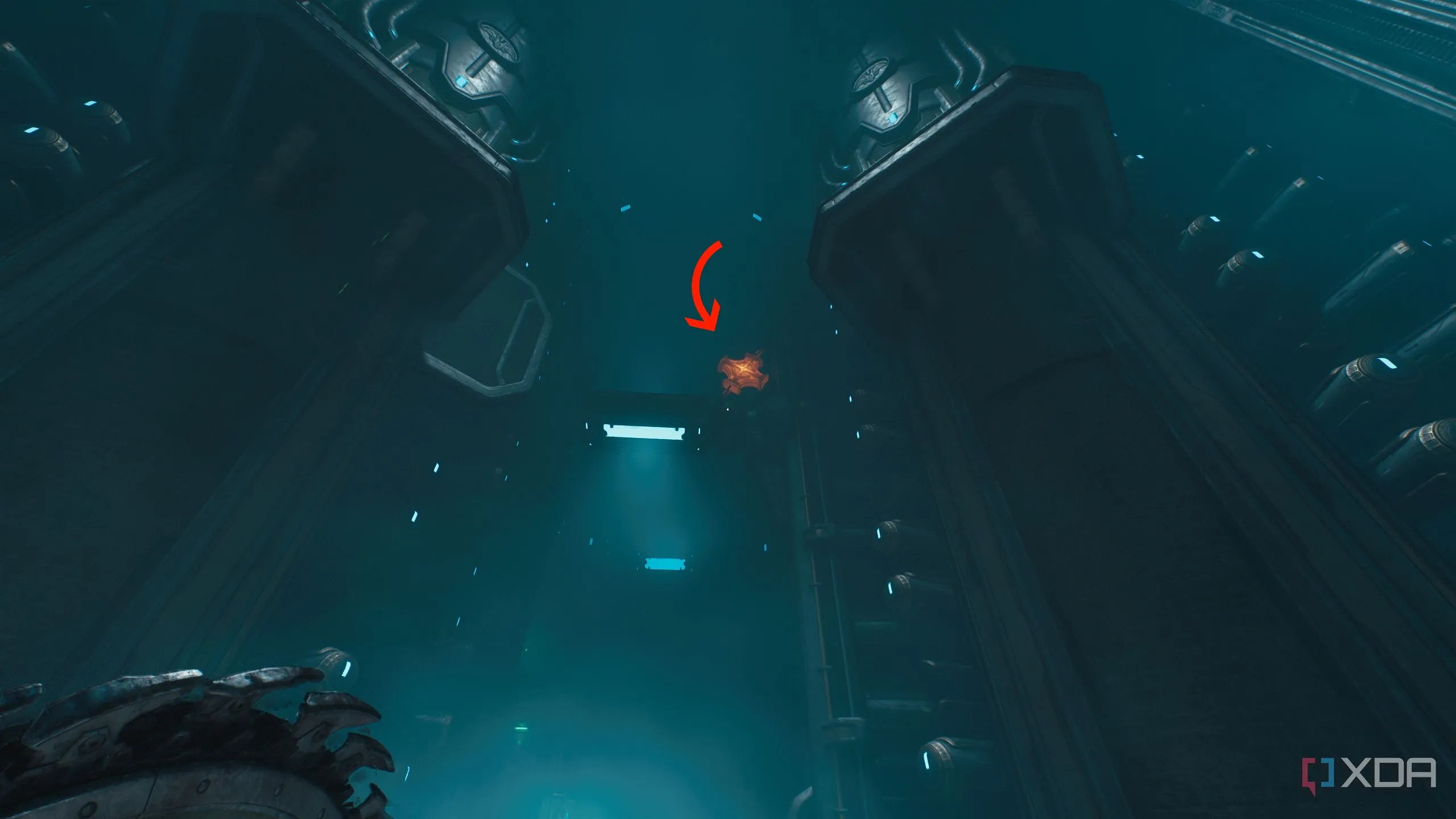 Mũi tên chỉ cây thánh giá kim loại nóng chảy phía trên, cần phá vỡ để tiếp tục trong Doom The Dark Ages