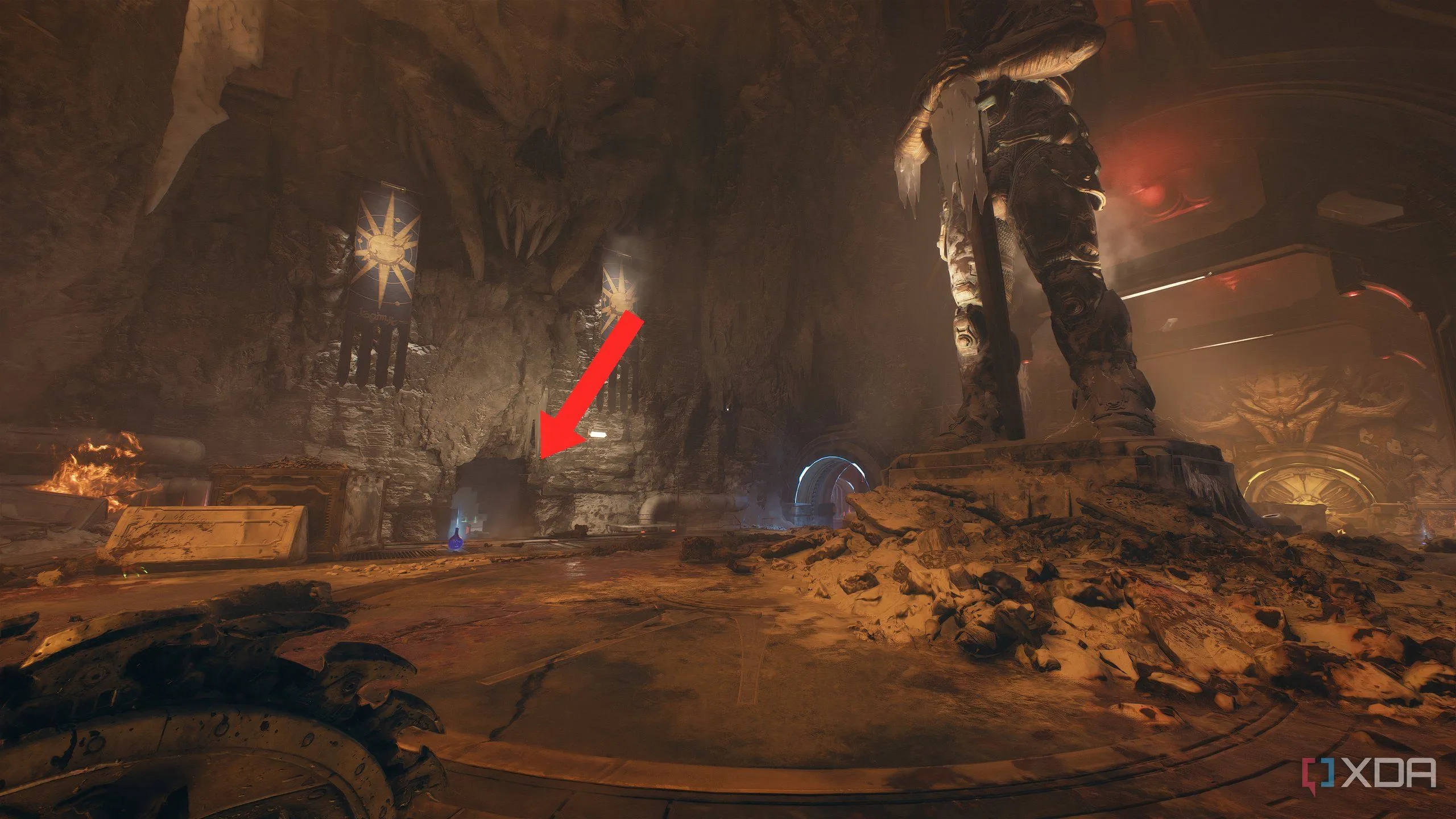 Mũi tên chỉ vào lỗ trên tường trong đấu trường Hiệp sĩ Sentinel, lối đi bí mật để quay lại tìm Khu vực bí mật 9.