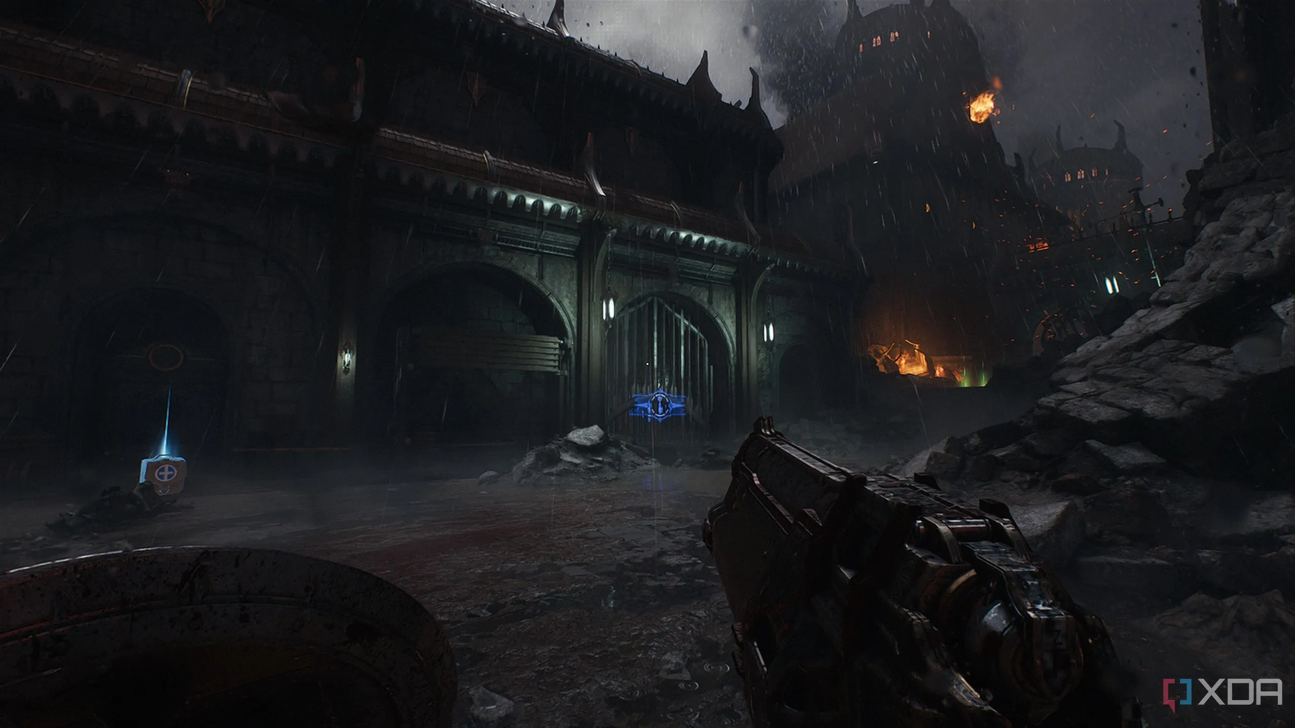 Tòa nhà thời trung cổ với cổng xanh dẫn đến khu vực bí mật chứa Imp Toy trong Doom The Dark Ages