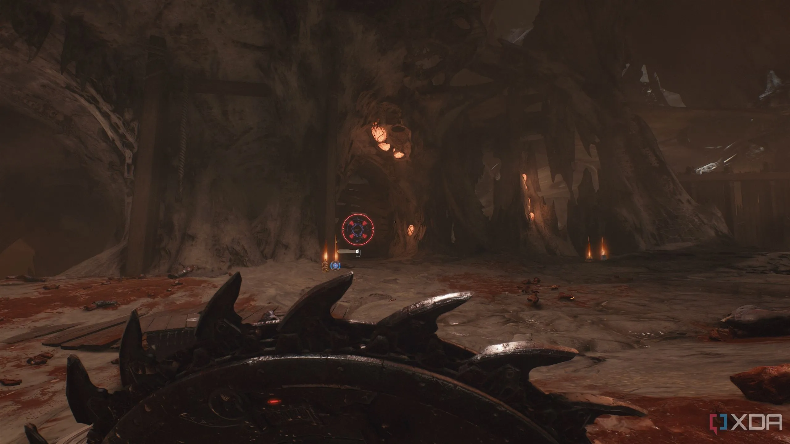 Tường gỗ có biểu tượng Shield Charge có thể phá vỡ để tìm thẻ khóa tím trong Lò rèn Tổ tiên