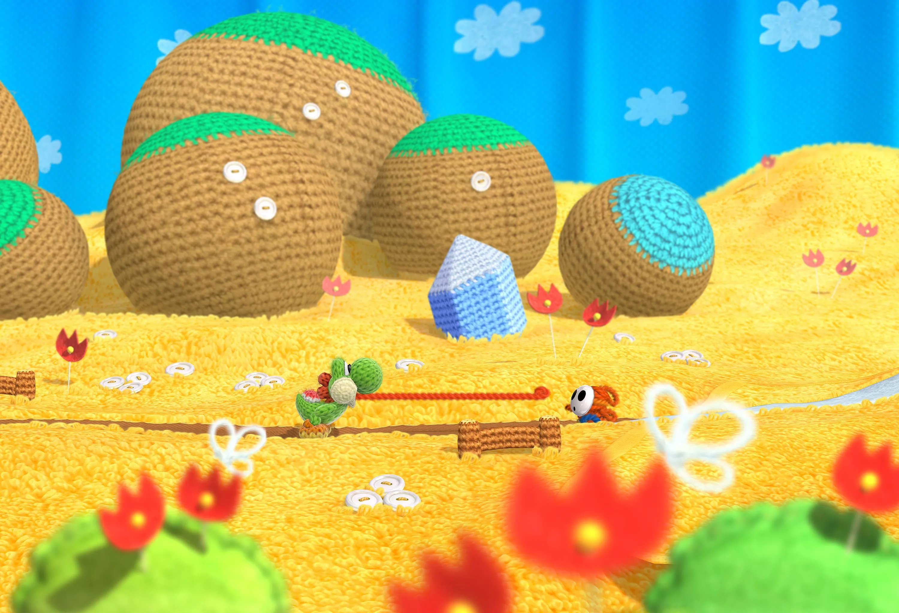 Yoshi đang vui vẻ trên nền của Yoshi's Woolly World trên Wii U